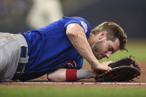 MILWAUKEE, WISCONSIN – JUNE 30: Patrick Wisdom #16 of the Chicago Cubs lays on the field after being injured. (Photo by Patrick McDermott/Getty Images)