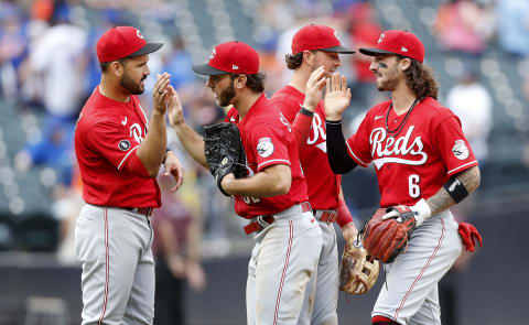 NEW YORK, NEW YORK – AUGUST 01: (L-R) Eugenio Suarez #7, Max Schrock #32, Kyle Farmer #17, and Jonathan India #6 of the Cincinnati Reds celebrate. (Photo by Jim McIsaac/Getty Images)