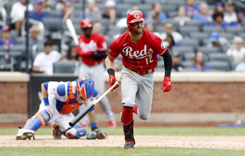 NEW YORK, NEW YORK – AUGUST 01: Tyler Naquin #12 of the Cincinnati Reds follows through on his ninth-inning two-run double. (Photo by Jim McIsaac/Getty Images)