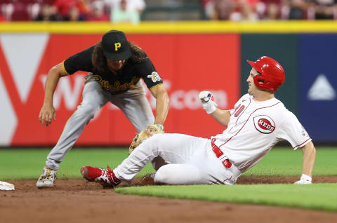 CINCINNATI, OHIO – SEPTEMBER 21: Tyler Mahle #30 of the Cincinnati Reds is tagged out by Cole Tucker #3 of the Pittsburgh Pirates. (Photo by Andy Lyons/Getty Images)