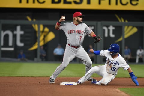 KANSAS CITY, MO – JUNE 12: Eugenio Suarez #7 of the Cincinnati Reds throws to first past Whit Merrifield #15 of the Kansas City Royals (Photo by Ed Zurga/Getty Images)