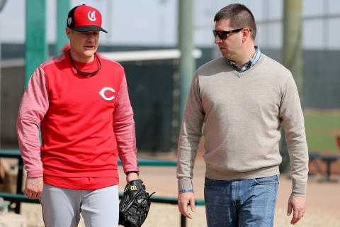 Cincinnati Reds manager David Bell (25), left, talks with general manager Nick Krall, right, Cincinnati Reds pitchers and catchers work out, Friday, Feb. 15, 2019, at the Cincinnati Reds spring training facility in Goodyear, Arizona.Cincinnati Reds Spring Training 2 15 2019