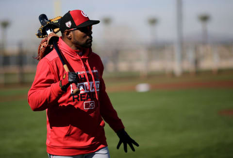 Former Reds shortstop Barry Larkin walks between practice fields.