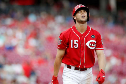 Cincinnati Reds center fielder Nick Senzel (15) reacts after striking out in the ninth inning.