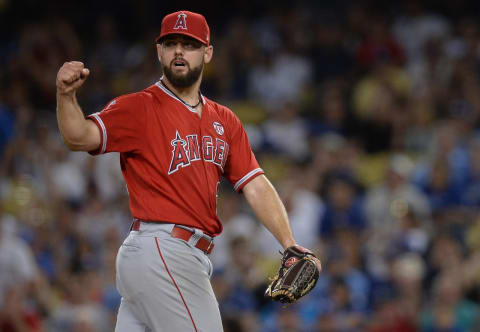 July 24, 2019; Los Angeles, CA, USA; Los Angeles Angels relief pitcher Cam Bedrosian (32) reacts after a double play to end the bottom of the eighth inning. Bedrosian signed a minor-league deal with the Cincinnati Reds. Mandatory Credit: Gary A. Vasquez-USA TODAY Sports