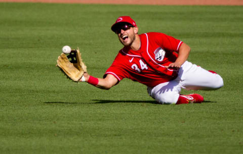 Cincinnati Reds center fielder Mark Payton (34) catches a fly ball in the second inning of the Reds scrimmage.