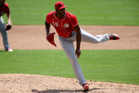 Cincinnati Reds relief pitcher Amir Garrett (50) follows through.