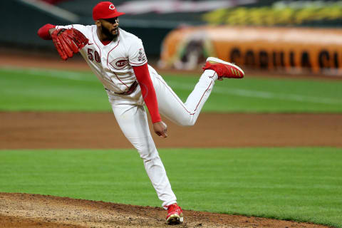 Cincinnati Reds relief pitcher Amir Garrett (50) follows through on a delivery.