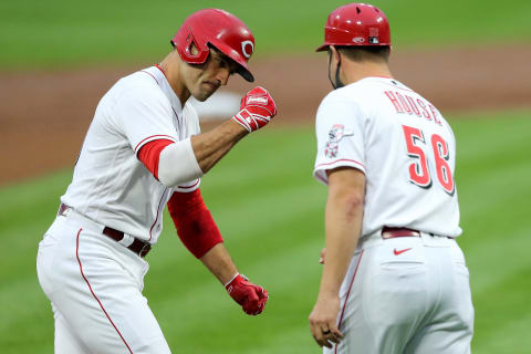 Cincinnati Reds first baseman Joey Votto (19) is congratulated by third base coach J.R. House after hitting a two-run home run.Milwaukee Brewers At Cincinnati Reds Sept 23