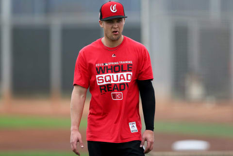 Cincinnati Reds infielder/outfielder Nick Senzel (15) works out along other outfielders.