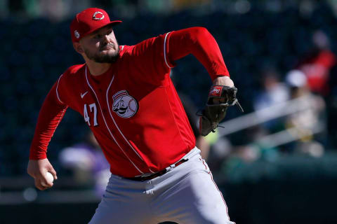 Cincinnati Reds pitcher Sal Romano (47) throws a pitch.