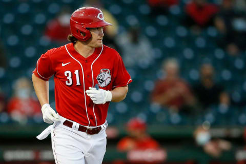 Cincinnati Reds shortstop Kyle Holder (31) jogs to first on a walk in the first inning.