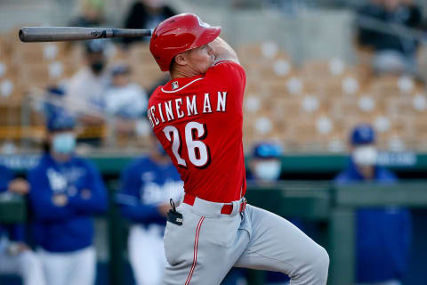 Cincinnati Reds left fielder Scott Heineman (26) follows through on a line drive single.