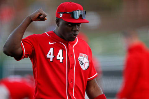 Cincinnati Reds right fielder Aristides Aquino (44) flashes his signature arm flex for fans.