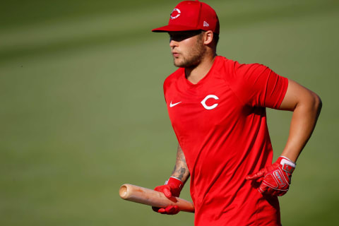 Cincinnati Reds center fielder Nick Senzel (15) runs in for batting practice before the first inning of the MLB Cactus League Spring Training game.