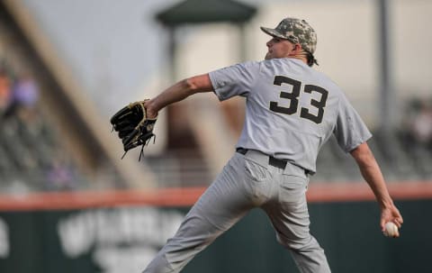 Wake Forest sophomore Ryan Cusick pitches to Clemson during the bottom of the first inning at Doug Kingsmore Stadium in Clemson Friday, April 23,2021.Clemson Vs Wake Forest Baseball