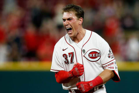 Cincinnati Reds catcher Tyler Stephenson (37) screams as Jonathan India (6) crosses the plate on his game-winning single.