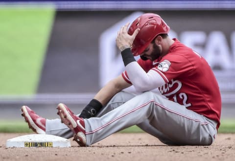 Aug 26, 2021; Milwaukee, Wisconsin, USA; Cincinnati Reds center fielder Tyler Naquin (12) reacts after being called out. Mandatory Credit: Benny Sieu-USA TODAY Sports