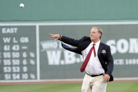 August 3, 2012; Boston, MA, USA; Boston Red Sox former pitcher Curt Schilling throws out a ceremonial first pitch prior to a game against the Minnesota Twins at Fenway Park. Mandatory Credit: Bob DeChiara-USA TODAY Sports