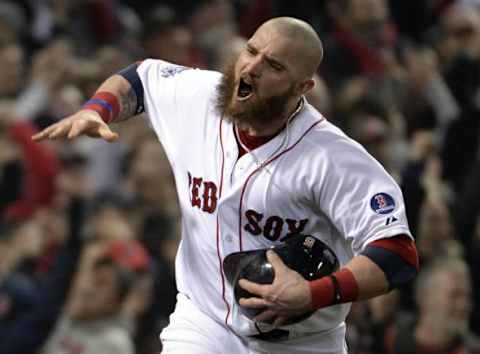 Oct 30, 2013; Boston, MA, USA; Boston Red Sox left fielder Jonny Gomes celebrates after scoring a run against the St. Louis Cardinals in the third inning during game six of the MLB baseball World Series at Fenway Park. Mandatory Credit: Robert Deutsch-USA TODAY Sports