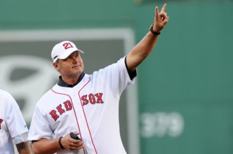 Jul 30, 2013; Boston, MA, USA; Boston Red Sox former pitcher Roger Clemens waves to the crowd during pre game ceremonies against the Seattle Mariners at Fenway Park. Mandatory Credit: Bob DeChiara-USA TODAY Sports