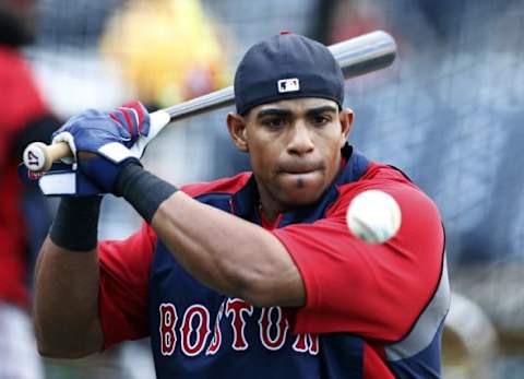 Sep 17, 2014; Pittsburgh, PA, USA; Boston Red Sox left fielder Yoenis Cespedes (52) hits balls to infielders during batting practice before playing the Pittsburgh Pirates at PNC Park. Mandatory Credit: Charles LeClaire-USA TODAY Sports