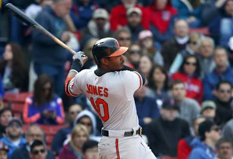 Apr 19, 2015; Boston, MA, USA; Baltimore Orioles center fielder Adam Jones (10) follows through on a three-run double against the Boston Red Sox during the sixth inning at Fenway Park. Mandatory Credit: Winslow Townson-USA TODAY Sports