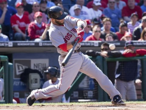 Apr 6, 2015; Philadelphia, PA, USA; Boston Red Sox second baseman Dustin Pedroia (15) hits a home run against the Philadelphia Phillies during the first inning on opening day at Citizens bank Park. Mandatory Credit: Bill Streicher-USA TODAY Sports