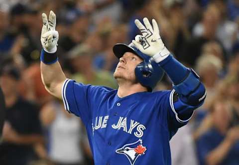 Jun 10, 2015; Toronto, Ontario, CAN; Toronto Blue Jays third baseman Josh Donaldson (20) celebrates as he crosses home plate after hitting a home run against Miami Marlins in the seventh inning at Rogers Centre. Mandatory Credit: Dan Hamilton-USA TODAY Sports