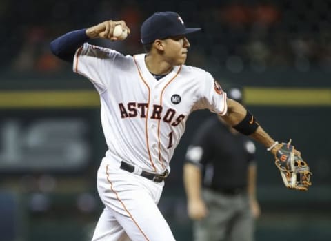 Sep 22, 2015; Houston, TX, USA; Houston Astros shortstop Carlos Correa (1) throws out a runner at first base during the sixth inning against the Los Angeles Angels at Minute Maid Park. Mandatory Credit: Troy Taormina-USA TODAY Sports