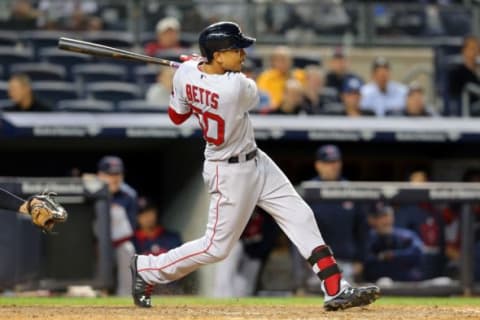 Sep 30, 2015; Bronx, NY, USA; Boston Red Sox center fielder Mookie Betts (50) hits a two run home run against the New York Yankees during the eleventh inning at Yankee Stadium. Mandatory Credit: Brad Penner-USA TODAY Sports