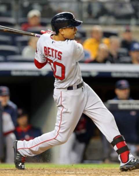 Sep 30, 2015; Bronx, NY, USA; Boston Red Sox center fielder Mookie Betts (50) rounds the bases after hitting a solo home run against the New York Yankees seventh inning at Yankee Stadium. Mandatory Credit: Brad Penner-USA TODAY Sports