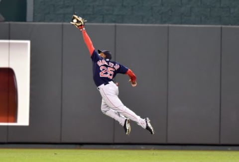 Sep 12, 2014; Kansas City, MO, USA; Boston Red Sox center fielder Jackie Bradley Jr. (25) makes a diving catch for the final out of the game against the Kansas City Royals during the ninth inning at Kauffman Stadium. Boston won 4-2. Mandatory Credit: Peter G. Aiken-USA TODAY Sports