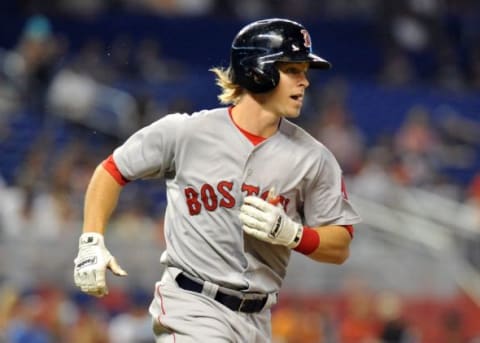 Aug 12, 2015; Miami, FL, USA; Boston Red Sox second baseman Brock Holt (26) runs to first base after hitting a single during the first inning against the Miami Marlins at Marlins Park. Mandatory Credit: Steve Mitchell-USA TODAY Sports