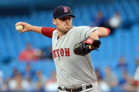 Jul 21, 2014; Toronto, Ontario, CAN; Boston Red Sox pitcher John Lackey throws against the Toronto Blue Jays at Rogers Centre. Mandatory Credit: Dan Hamilton-USA TODAY Sports