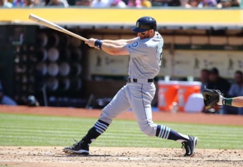 Sep 6, 2015; Oakland, CA, USA; Seattle Mariners second baseman Brad Miller (5) hits a single against the Oakland Athletics during the fifth inning at O.co Coliseum. Mandatory Credit: Kelley L Cox-USA TODAY Sports