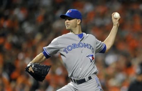 Sep 17, 2014; Baltimore, MD, USA; Toronto Blue Jays pitcher J.A. Happ (48) pitches in the third inning against the Baltimore Orioles at Oriole Park at Camden Yards. Mandatory Credit: Joy R. Absalon-USA TODAY Sports