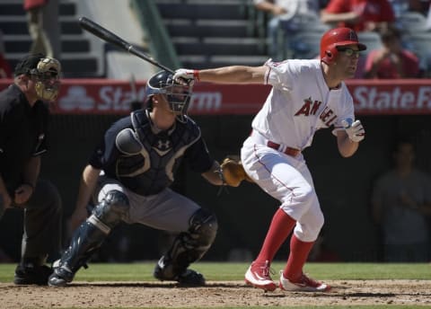 Sep 27, 2015; Anaheim, CA, USA; Los Angeles Angels left fielder David Murphy (19) follows through on a swing for a RBI single against the Seattle Mariners during the fourth inning at Angel Stadium of Anaheim. Mandatory Credit: Kelvin Kuo-USA TODAY Sports