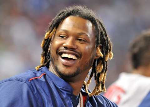 Aug 12, 2015; Miami, FL, USA; Boston Red Sox left fielder Hanley Ramirez (13) looks on from the dugout during the sixth inning against the Miami Marlins at Marlins Park. Mandatory Credit: Steve Mitchell-USA TODAY Sports