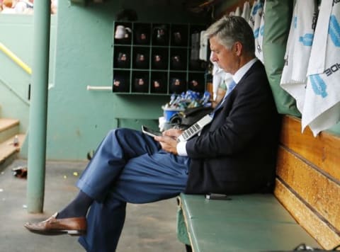 Jul 26, 2015; Boston, MA, USA; Detroit Tigers President, CEO and General Manager Dave Dombrowski works in the dugout before their game against the Boston Red Sox at Fenway Park. Mandatory Credit: Winslow Townson-USA TODAY Sports