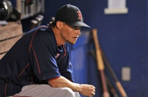 Aug 12, 2015; Miami, FL, USA; Boston Red Sox starting pitcher Clay Buchholz (11) looks on from the dugout during the ninth inning against the Miami Marlins at Marlins Park. Mandatory Credit: Steve Mitchell-USA TODAY Sports