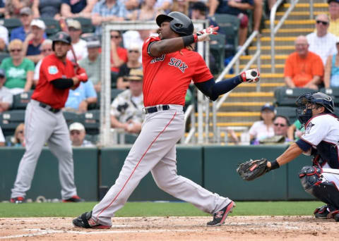 Mar 29, 2016; Fort Myers, FL, USA; Boston Red Sox designated hitter Hanley Ramirez (13) connects for an RBI single during the third inning against the Minnesota Twins at CenturyLink Sports Complex. Mandatory Credit: Steve Mitchell-USA TODAY Sports