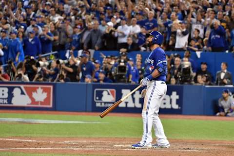 Oct 14, 2015; Toronto, Ontario, CAN; Toronto Blue Jays right fielder Jose Bautista hits a three-run home run against the Texas Rangers in the 7th inning in game five of the ALDS at Rogers Centre. Mandatory Credit: Nick Turchiaro-USA TODAY Sports