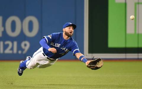 Oct 14, 2015; Toronto, Ontario, CAN; Toronto Blue Jays center fielder Kevin Pillar catches a fly ball hit by Texas Rangers left fielder Josh Hamilton (not pictured) in the fourth inning in game five of the ALDS at Rogers Centre. Mandatory Credit: Dan Hamilton-USA TODAY Sports