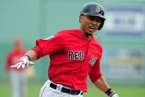 Mar 19, 2016; Fort Myers, FL, USA; Boston Red Sox outfielder Mookie Betts (50) celebrates after hitting a home run in the fifth inning against the St. Louis Cardinals at JetBlue Park. The Red Sox won 3-1 as the game was cancelled after five innings due to inclement weather. Mandatory Credit: Evan Habeeb-USA TODAY Sports