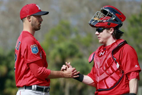 Feb 20, 2016; Lee County, FL, USA; Boston Red Sox starting pitcher Rick Porcello (22) and catcher Ryan Hanigan (10) hand shake as they get done throwing a bullpen at Jet Blue Park. Mandatory Credit: Kim Klement-USA TODAY Sports