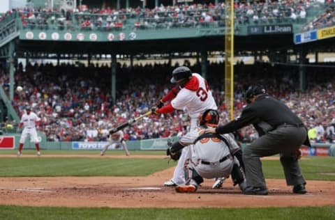 Apr 11, 2016; Boston, MA, USA; Boston Red Sox designated hitter David Ortiz (34) gets a base hit against the Baltimore Orioles in the first inning at Fenway Park. Mandatory Credit: David Butler II-USA TODAY Sports