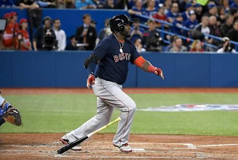 Apr 8, 2016; Toronto, Ontario, CAN; Boston Red Sox designated hitter David Ortiz (34) hits an RBI double against Toronto Blue Jays in the third inning at Rogers Centre. Mandatory Credit: Dan Hamilton-USA TODAY Sports