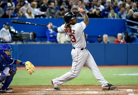 Apr 9, 2016; Toronto, Ontario, CAN; Boston Red Sox designated hitter Hanley Ramirez (13) hits a triple to score two runs against Toronto Blue Jays in the fifth inning at Rogers Centre. Mandatory Credit: Dan Hamilton-USA TODAY Sports