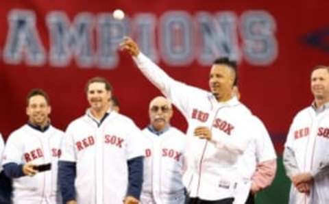 May 28, 2014; Boston, MA, USA; Boston Red Sox former player Manny Ramirez throws out the first pitch before the game against the Atlanta Braves at Fenway Park. Mandatory Credit: Greg M. Cooper-USA TODAY Sports